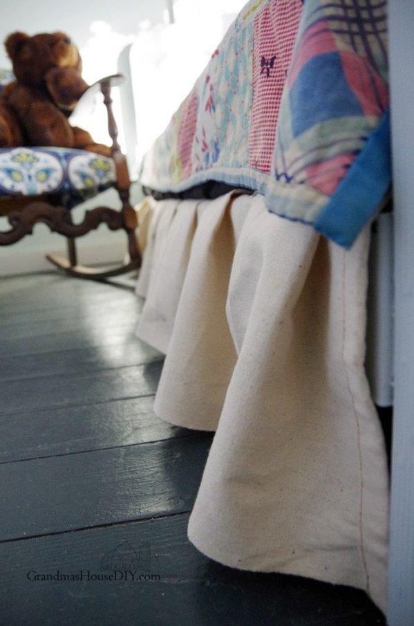 Making a country girl no-sew bed skirt with canvas drop cloths from Grandma's House DIY.