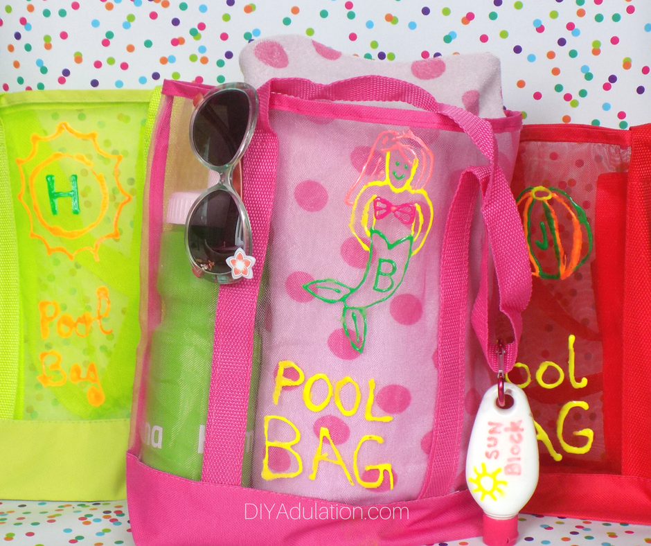 Colorful DIY Summer Pool Bags with Clip On Sunscreen from DIY Adulation.