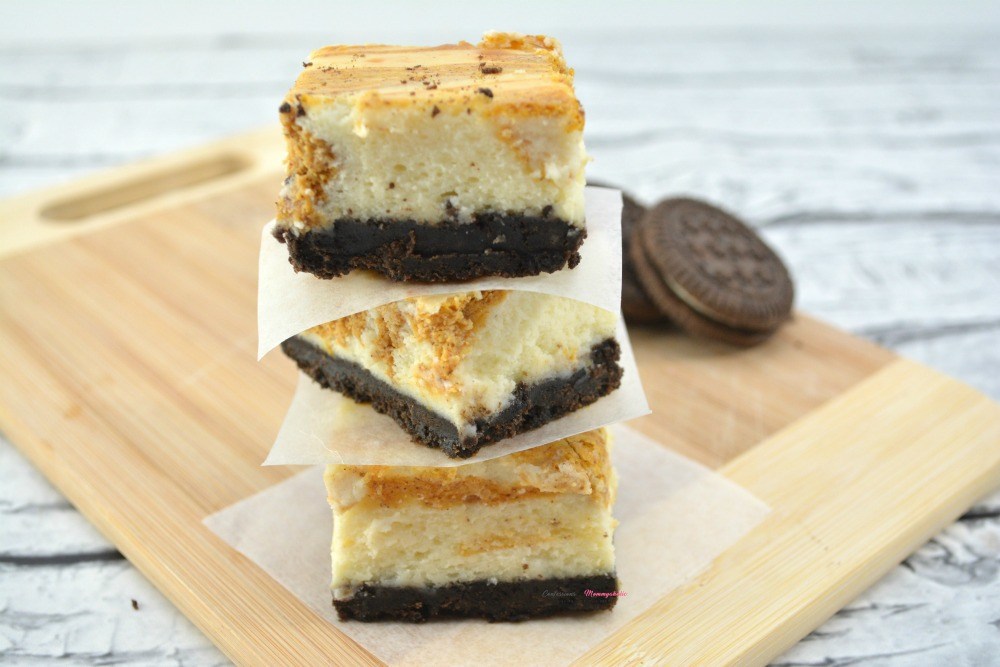 Pumpkin Pie Cheesecake Bars with Chocolate Cookie Crust Recipe from Confessions of a Mommyaholic.