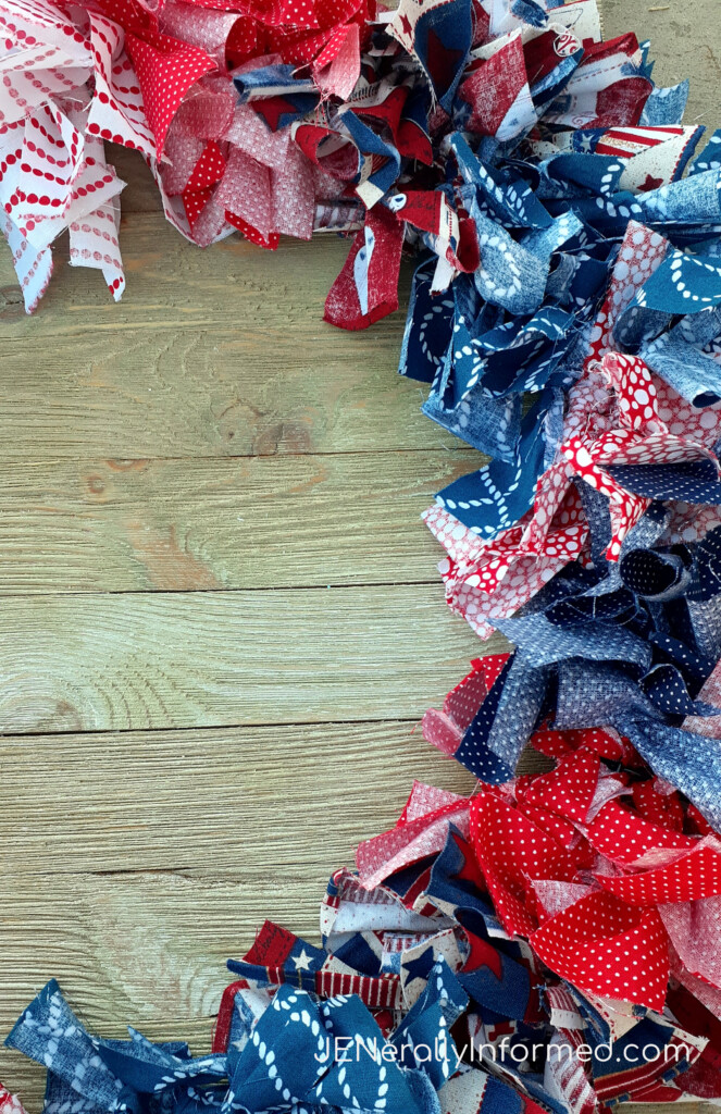 Here’s how to make a super easy and cute 4th of July Rag Wreath for less than $10 dollars! #crafting #DIY #homedecorations #Americana