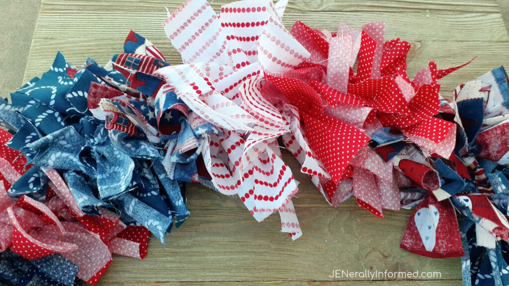 Here’s how to make a super easy and cute 4th of July Rag Wreath for less than $10 dollars! #crafting #DIY #homedecorations #Americana