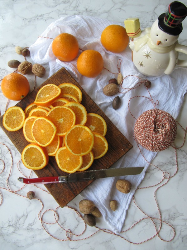 DIY Simple Dried Oranges for Christmas Decorating from Pinecones and Acorns.