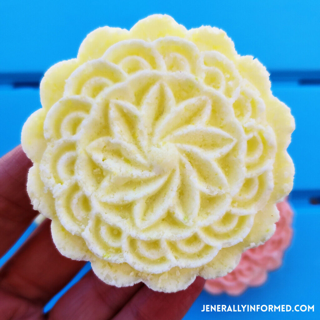 Want to learn how to make your own bath bombs, but think it might be too hard? Try this super easy recipe for DIY Flower-Shaped Pressed Bath Bombs!