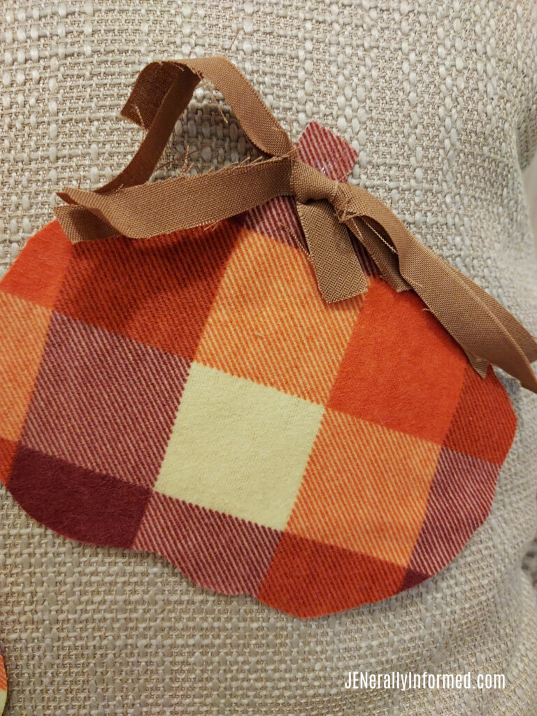 Learn how to make this adorable DIY pumpkin patterned pillow just in time for Fall! 