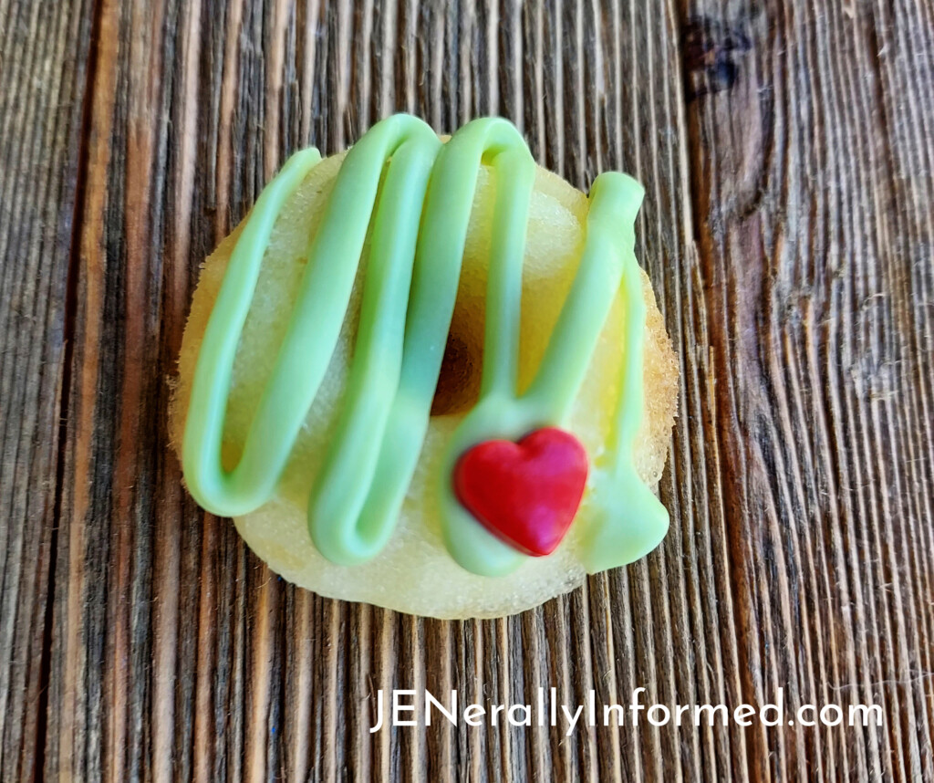 Warm any heart with these mini pineapple flavored with lime icing Grinch mini donuts!