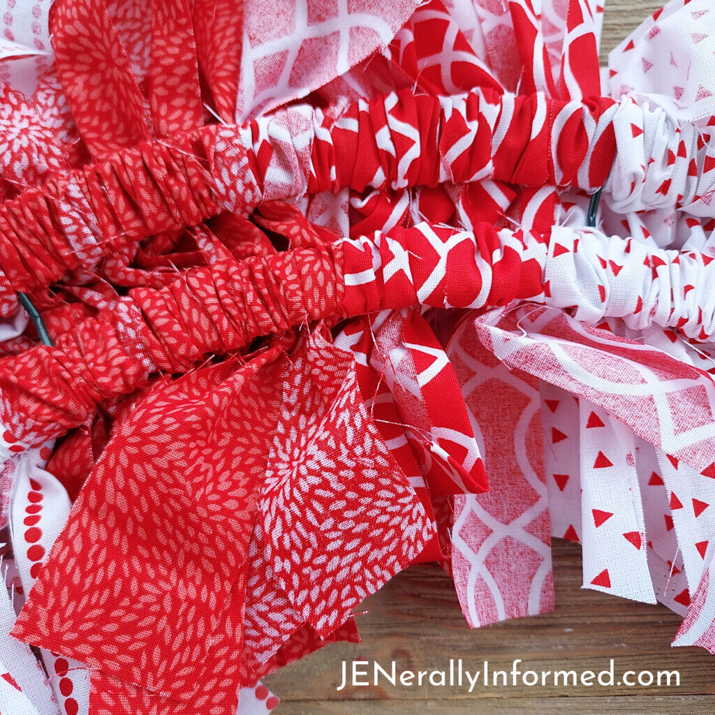 Here’s how to make a super easy and cute Valentine Rag Wreath for less than $20 dollars! #crafting #DIY #homedecorations