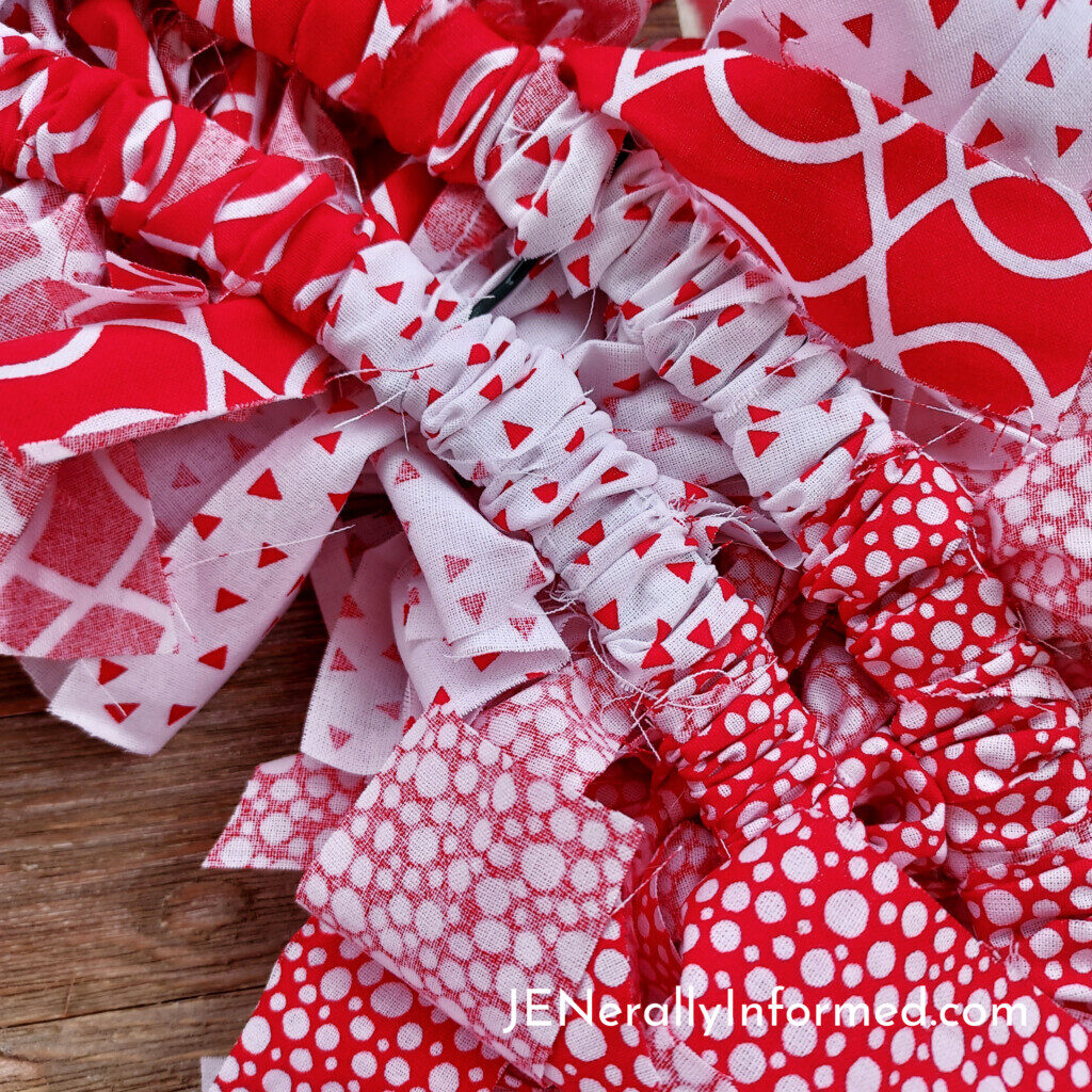 Here’s how to make a super easy and cute Valentine Rag Wreath for less than $20 dollars! #crafting #DIY #homedecorations