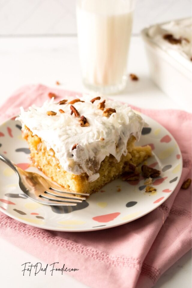 Coconut Pecan Poke Cake from Fat Dad Foodie.